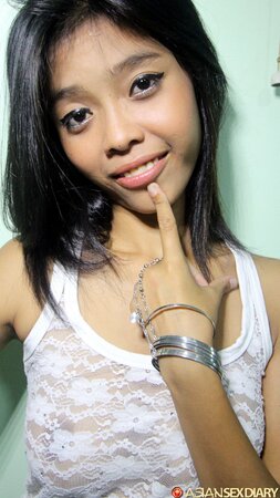 Pretty teen named Ariya is happy to show her grooling hole