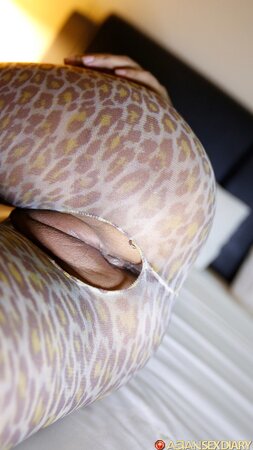 Bodystocking babe shows her firm ass and big wet pussy too