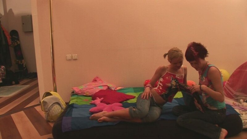 Lesbians Ksusha C and Nataly fuck on a couch with their sex toys