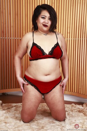 Chubby Asian whore strips and shows off her natural hairy body