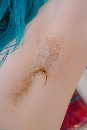 Blue hair amateur girl showing her firm ass and the rest of it