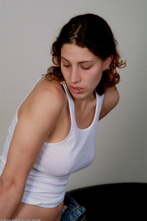 Stacked redhead in a see through tank top looks faultless