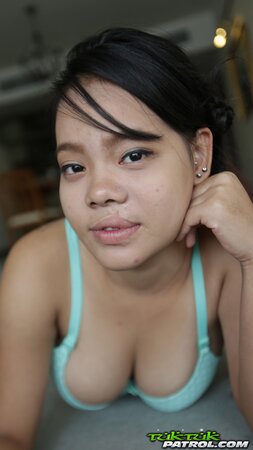 Cute Thai babe shows off her jugs to her new white friend