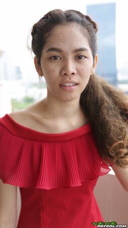 Sweet Thai teen has fun walking with a foreign photographer