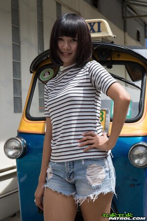 Lovely teen with a bob haircut strips to show her tight ass