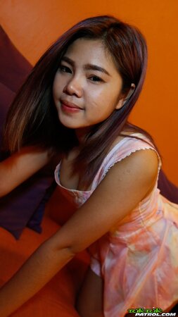 Sexy Asian teen strips her dress down to flaunt her hairy pussy