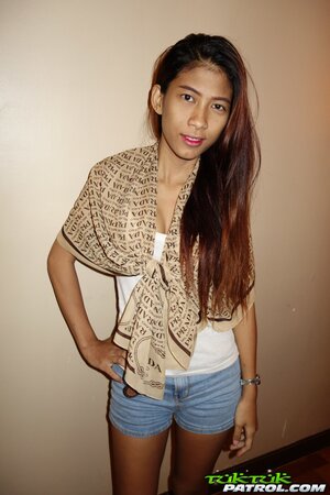 Skinny Thai teen shows off her perky tits and a hairy pussy