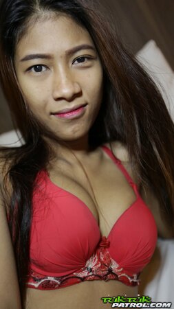 Skinny Thai teen shows off her perky tits and a hairy pussy