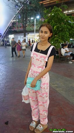 Edgy Thai babe named Puy is going to smoke and tease in overalls