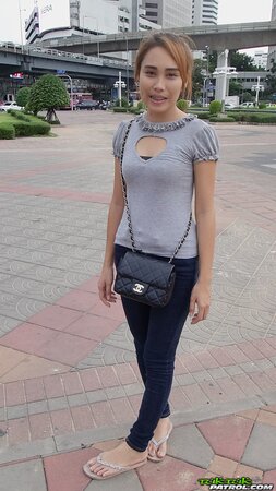 Young Thai babe shows her natural boobs and pretty face