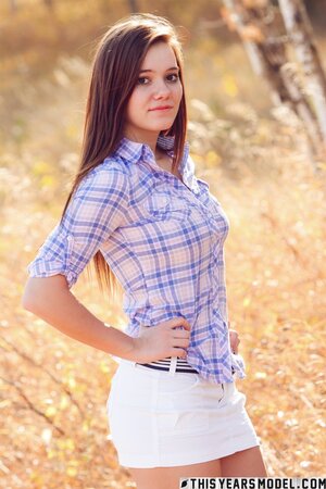 Girl next door showing her nice boobies while teasing outside