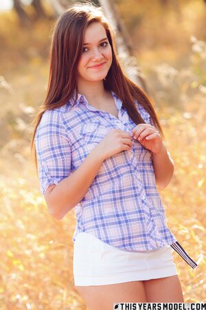 Girl next door showing her nice boobies while teasing outside