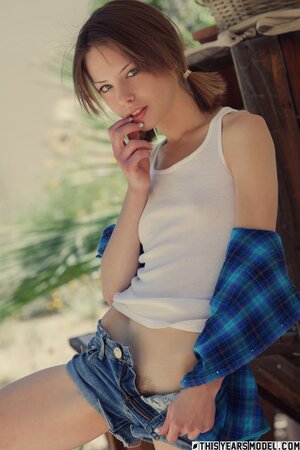 Cute cowgirl shows her hairy kitty with her natural boobs