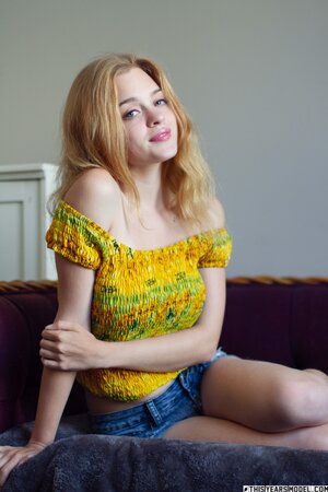 Adorable blonde in denim shorts seeks hot ways to seduce