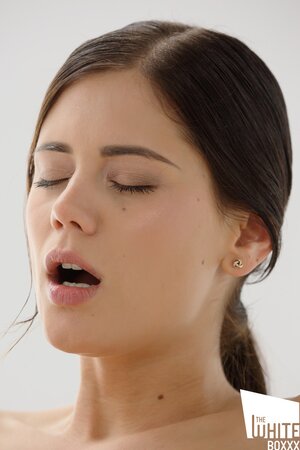 Brunette lets him play with her clit as she rides him hard