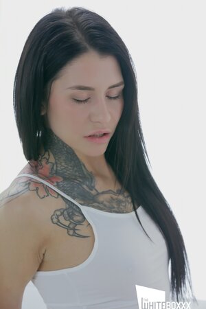 Brunette with odd lips and sexy tattoos riding his hard peen