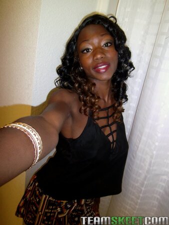 Horny ebony takes pics of her big round boobs to attract dicks