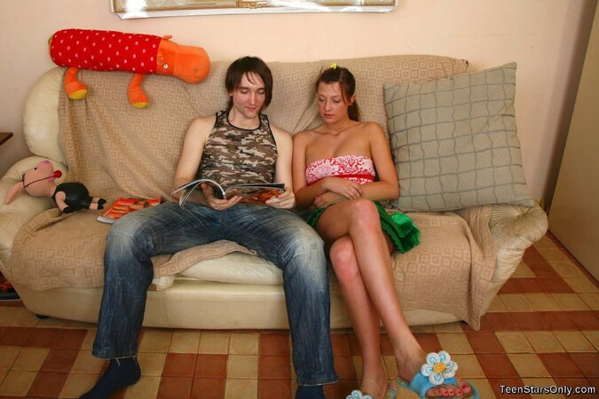 Seductive babe joins her cousin on a couch to ride his dick later