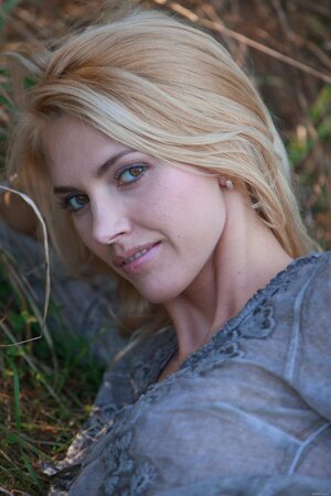 Blond haired and totally stunning fuckbaby posing in the woods