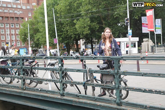Curvy girl with a goofy hairdo showing her stuff in public