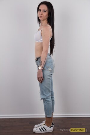 Pretty girl with sexy jeans on shows her tattoos and great pussy