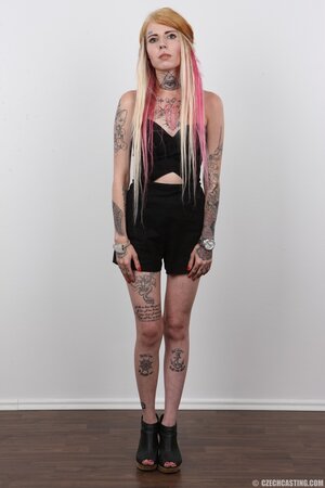 Edgy girl with a sexy body showing off her goodies solo