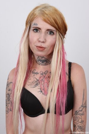 Edgy girl with a sexy body showing off her goodies solo