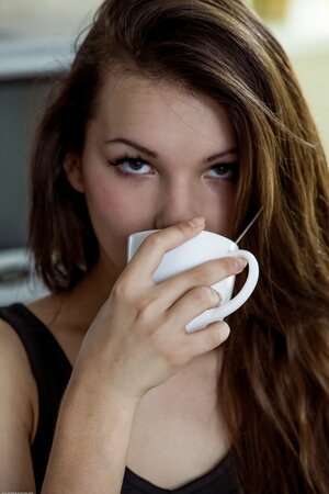 Iva Rogned seems to be enjoying her cup of Joe and your attention