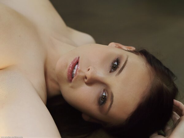 Pasty brunette with large breasts exposes her suckable pussy