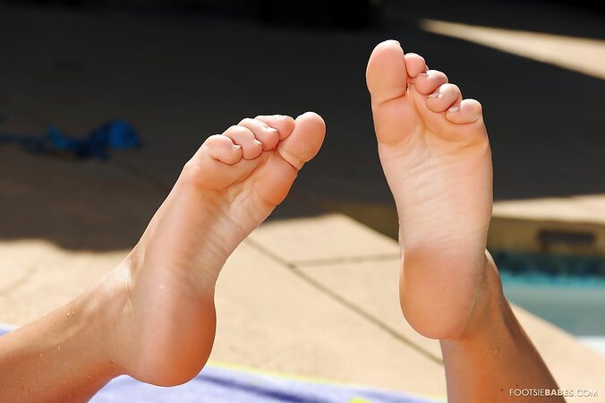 Tasha Reign shows her whooty and toes by the swimming pool