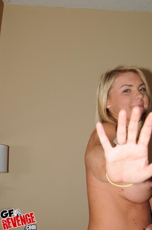 Big boobs blonde showing off her body and looking good too