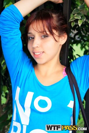 Attractive redhead with a firm behind showing off for the cam