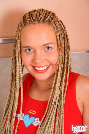 Dreadlocks girl fucking an eggplant in the kitchen big time