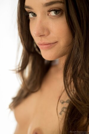 Gia Paige strips and masturbates her trimmed pussy