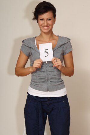 Emilia Argan strips and shows her tanned body