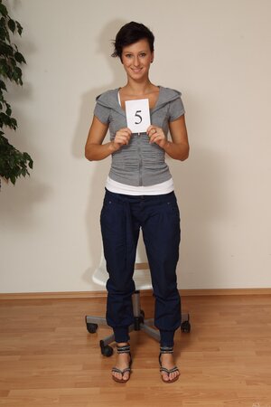 Emilia Argan strips and shows her tanned body