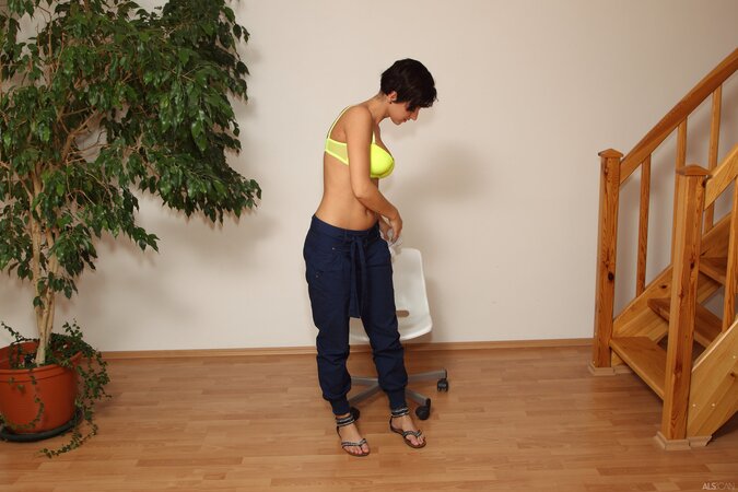 Emilia Argan strips and shows her tanned body