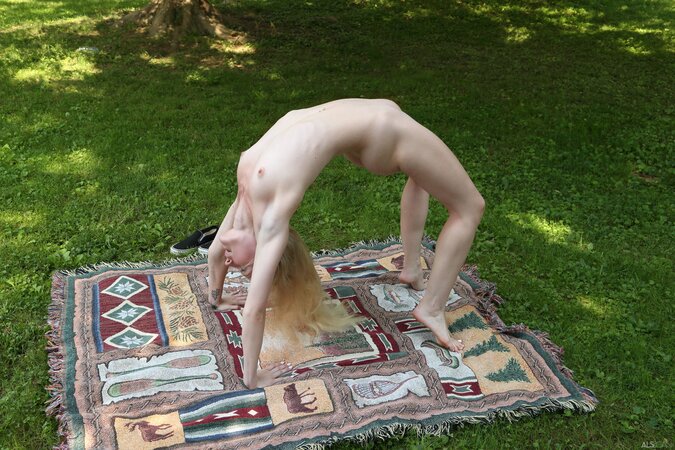 Emma Starletto is in the park where she masturbates and strips