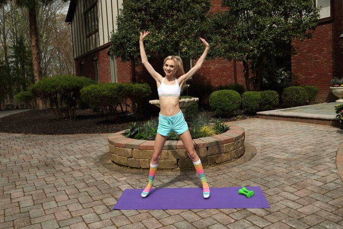 Petite blonde babe Chanel Shortcake fists herself on a yoga mat