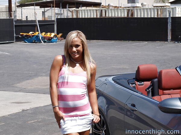 Love takes off her clothes and touches pink pussy sitting in a convertible