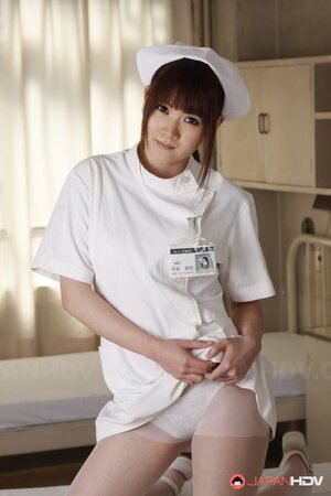 Two Japanese nurses take clothes off and pose dressed only in white lingerie