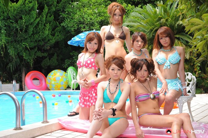 Oriental girlfriends in skimpy bikinis rest half-naked with men poolside