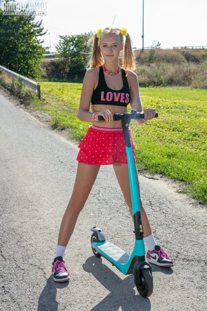 Adorable young girl Nana strips down on her scooter ride