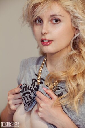 Angelik peels off her clothes to spread naked at her desk