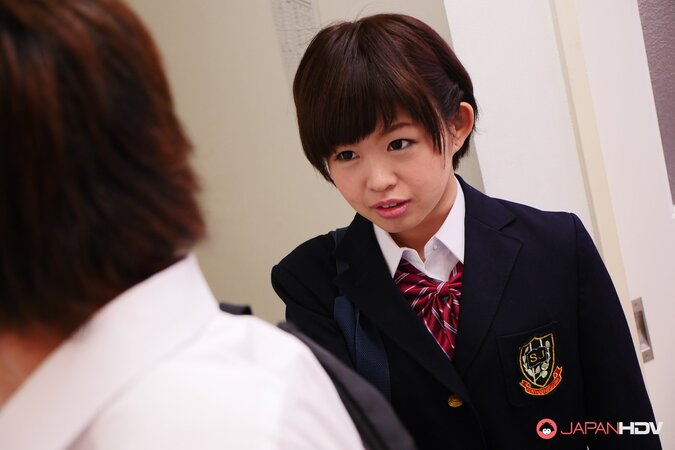 Naughty Asian schoolgirl Kaho Miyazaki gives a blowjob in class