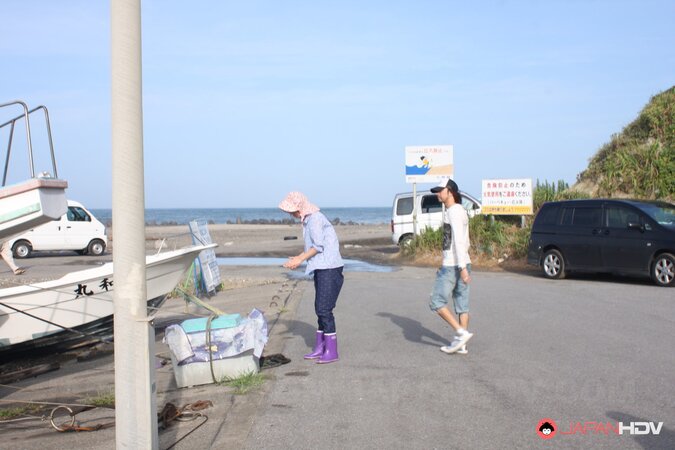 Japanese girl gets pleasured through her pants in rubber boots