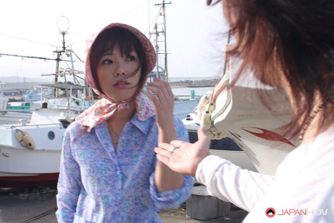 Japanese girl gets pleasured through her pants in rubber boots