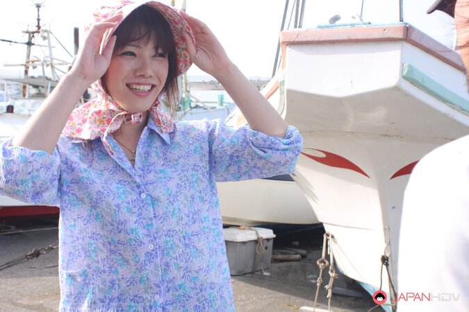 Japanese girl gets pleasured through her pants in rubber boots