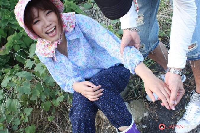 Japanese girl gets pleasured through her pants in rubber boots