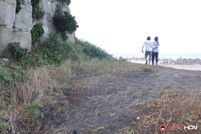 Japanese girl gets pleasured through her pants in rubber boots